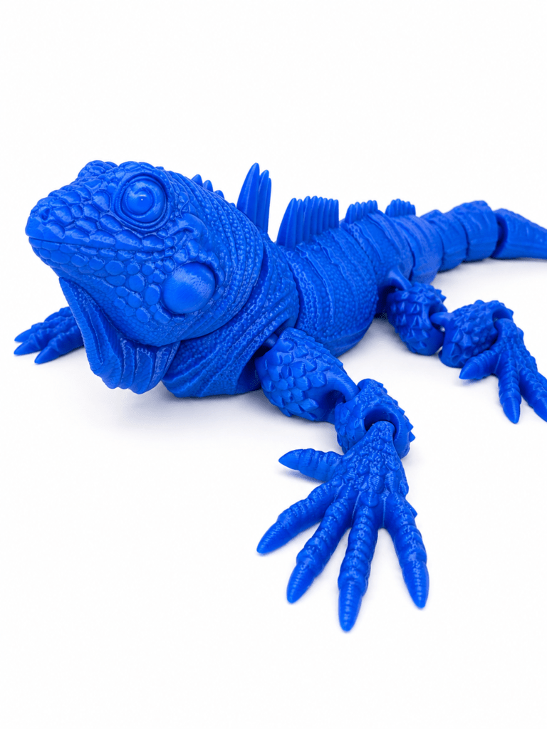 Blue articulated flexi iguana toy with detailed scales and segmented body.