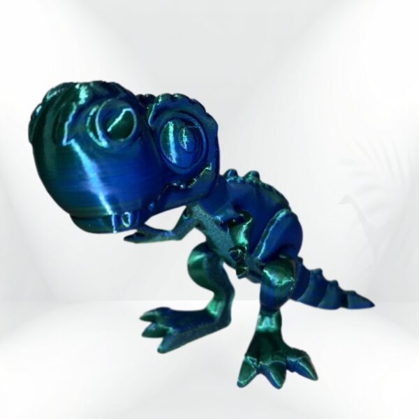 3D-printed T-Rex dinosaur figurine, teal and blue iridescent finish.