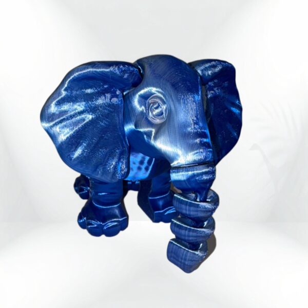 3D-printed blue elephant figurine with a curled trunk.