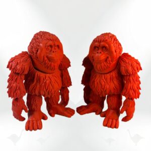 Two collectible Orangutan figurines, bright orange with detailed fur texture.