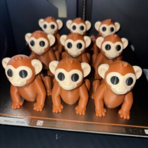 3D print monkey figurine. Brown and white toy animal printed in a 3D printer. Perfect as a gift or display piece.