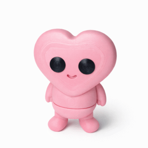 Love Buddy Desk Toy: Pink heart-shaped figure with black eyes