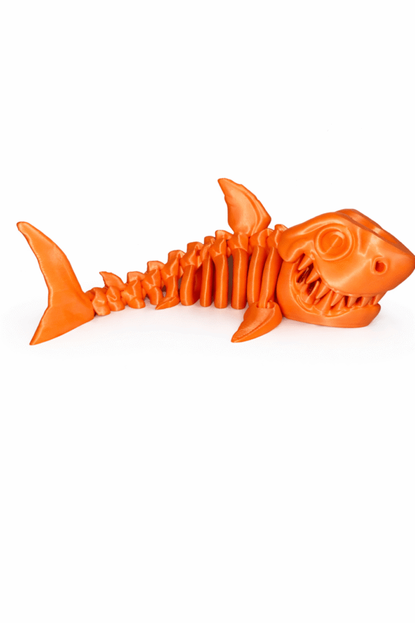 Orange 3D printed Shark skeleton toy.