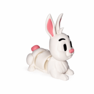 White plastic toy rabbit with pink accents, lying down.