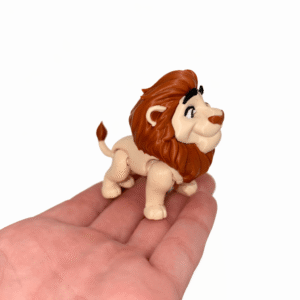 Lion toy figure with brown mane, standing on a hand.