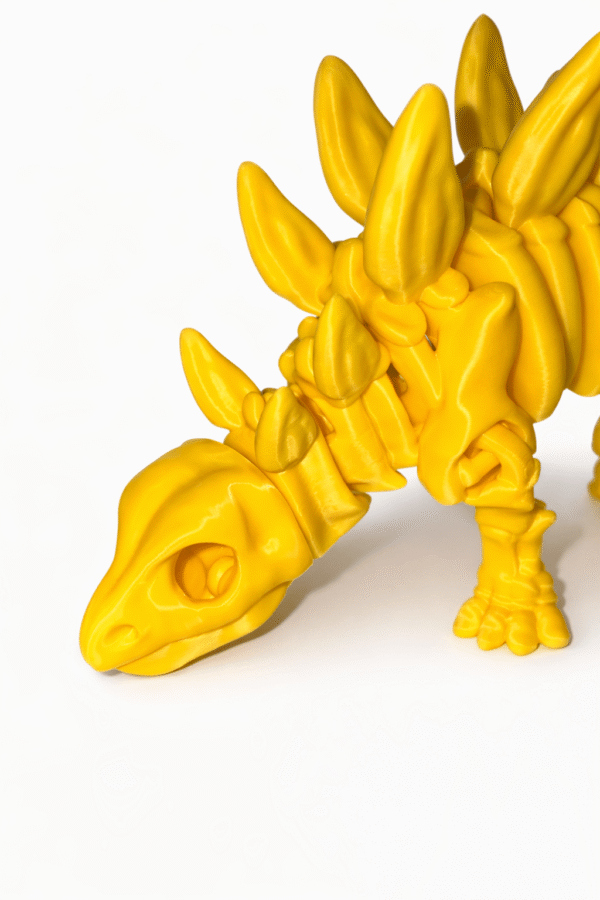 Yellow 3D printed Stegosaurus skeleton figurine