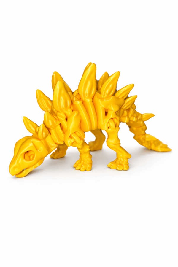 Yellow Stegosaurus toy dinosaur figure with detailed scales and plates