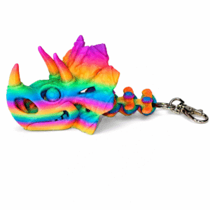 Rainbow gradient 3D printed Triceratops skull keychain with articulated neck.