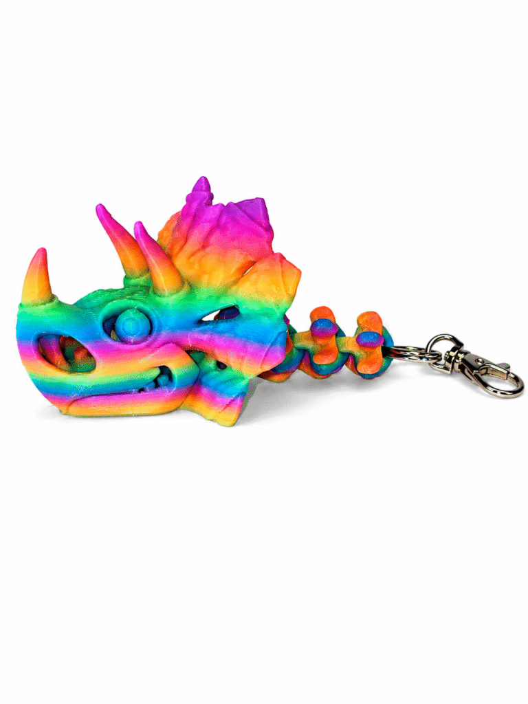 Rainbow gradient 3D printed Triceratops skull keychain with articulated neck.