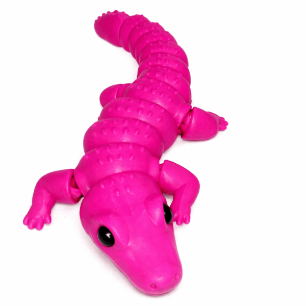 AUTO-DRAFT: Pink plastic toy alligator with flexible, segmented body