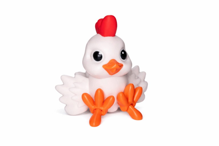 Cute white chicken figurine with red comb and orange feet