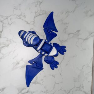 AUTO-DRAFT: Blue and white 3D-printed articulated pterodactyl toy, showcasing flexible design.