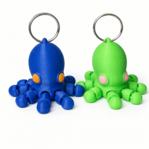 Blue and green 3D-printed baby octopus keychains with articulated tentacles and cute eye details