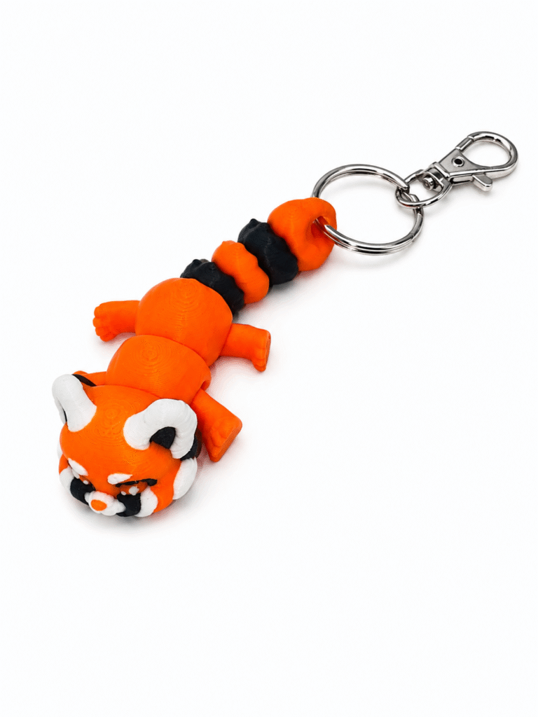 3D printed red panda keyring with a segmented body and metal clasp.